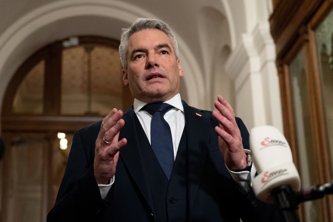 Austrian Chancellor and head of People's Party (OeVP) Karl Nehammer speaks with journalists after coalition talks in Vienna, Austria