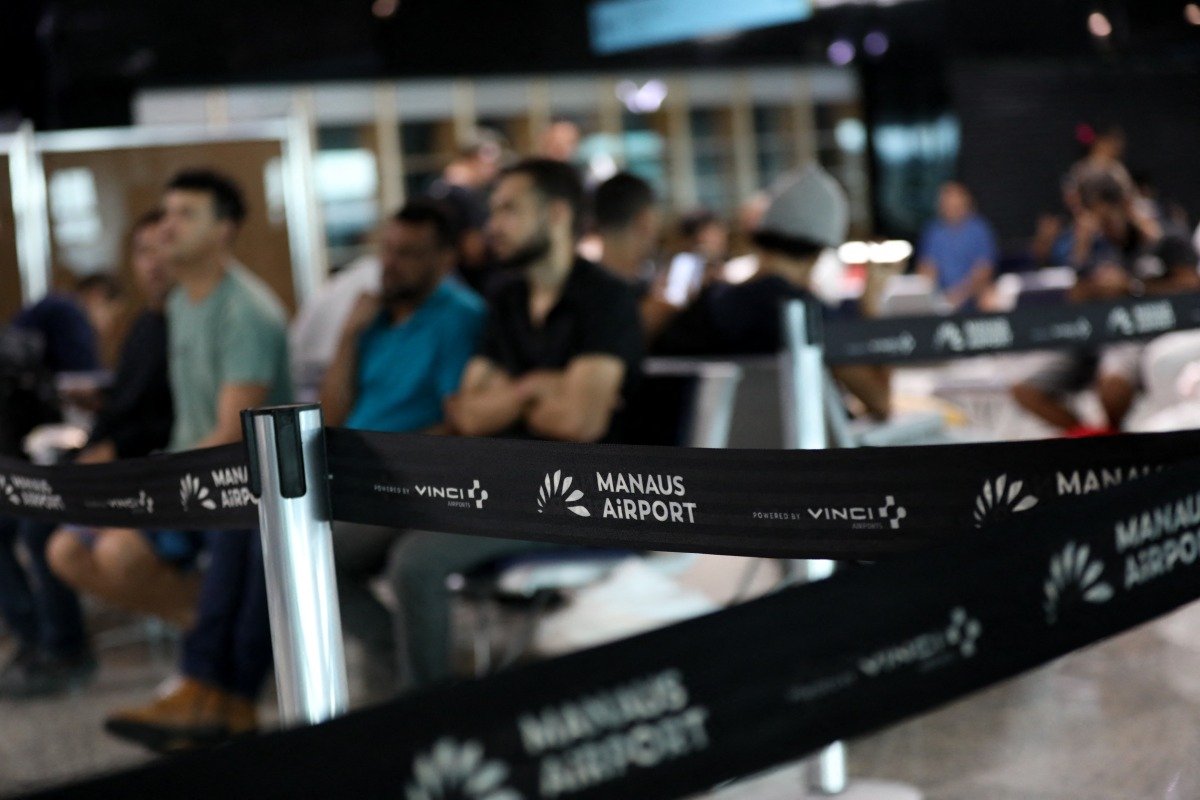 Brazilians who were deported from US wait at the departure lounge at Eduardo Gomes International Airport in Manaus, Amazonas state