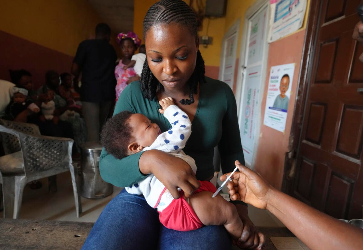 A health worker administers the malaria vaccine R21/Matrix-M to a child at the comprehensive Health Centre in Agudama-Epie, in Yenagoa, Nigeria, Monday, Dec. 9, 2024.