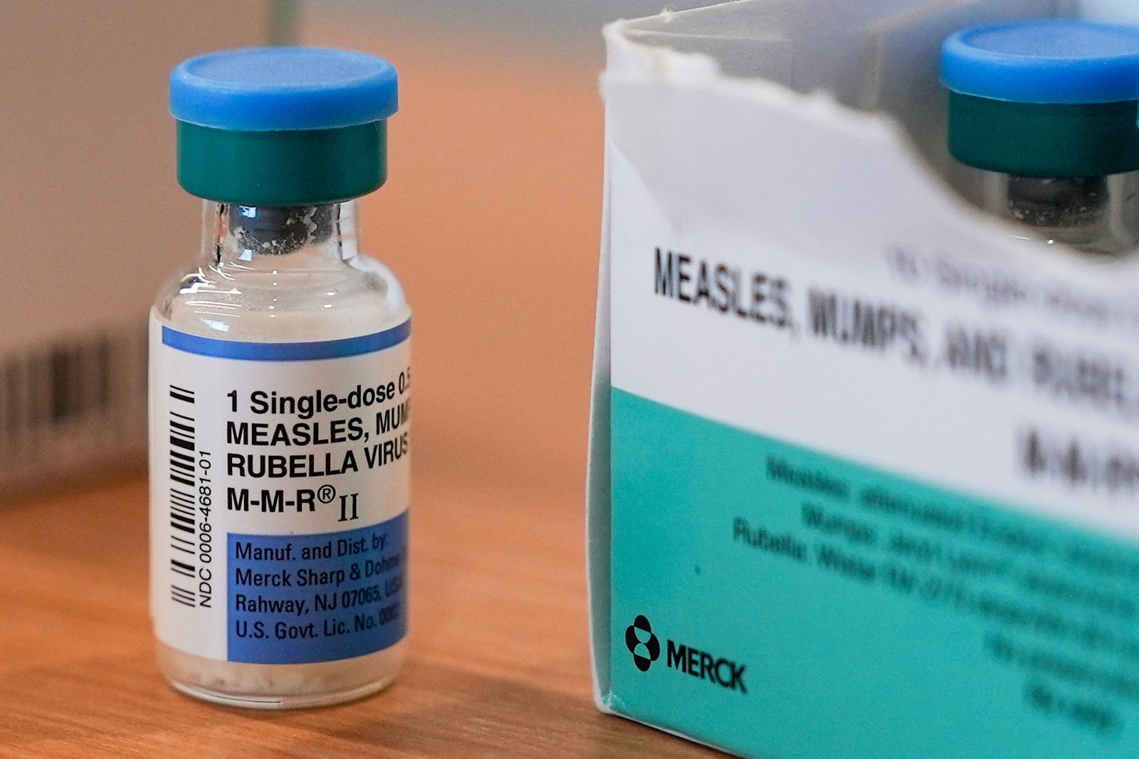 What causes breakthrough measles infections?