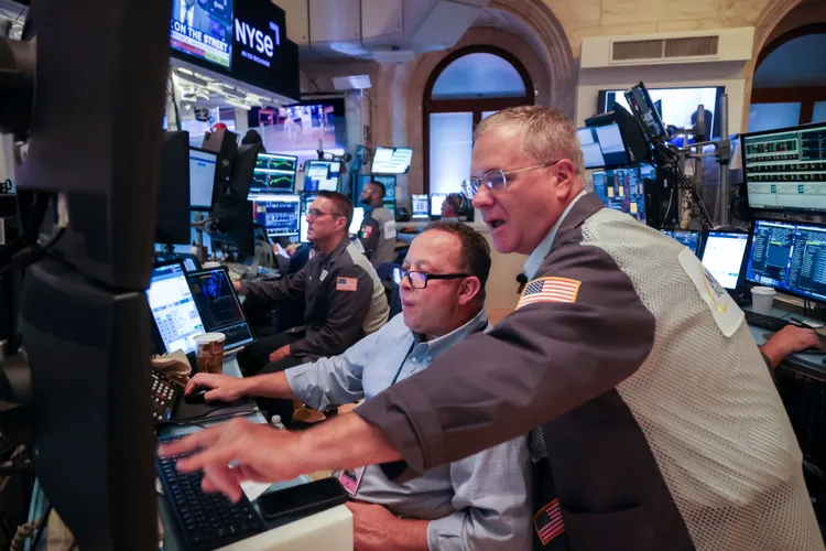 Wall Street hits record highs as inflation cools and earnings shine